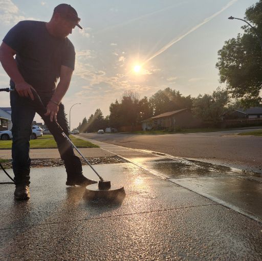 joel doing driveway maintenance sealcoating and driveway maintenance